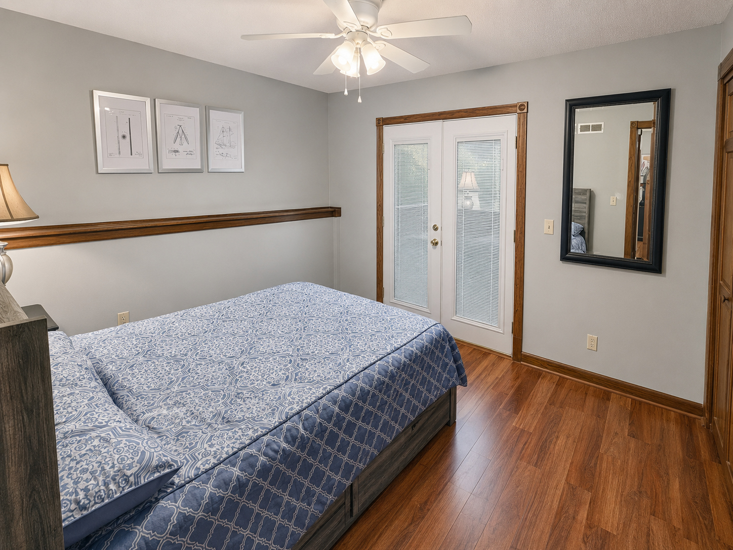 Primary bedroom with a view toward the patio in apartment 1301 B