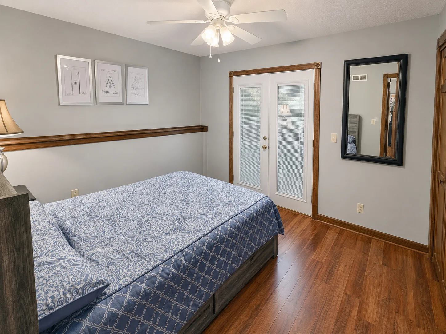 Primary bedroom with a view toward the patio in apartment 1301 B