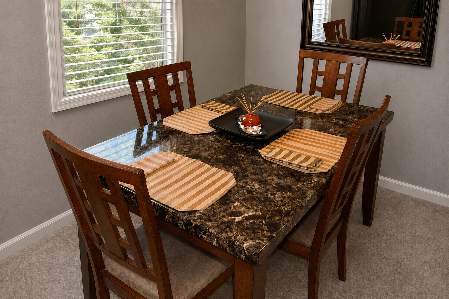 Dining table in apartment 1303 D with Morningside trees outside