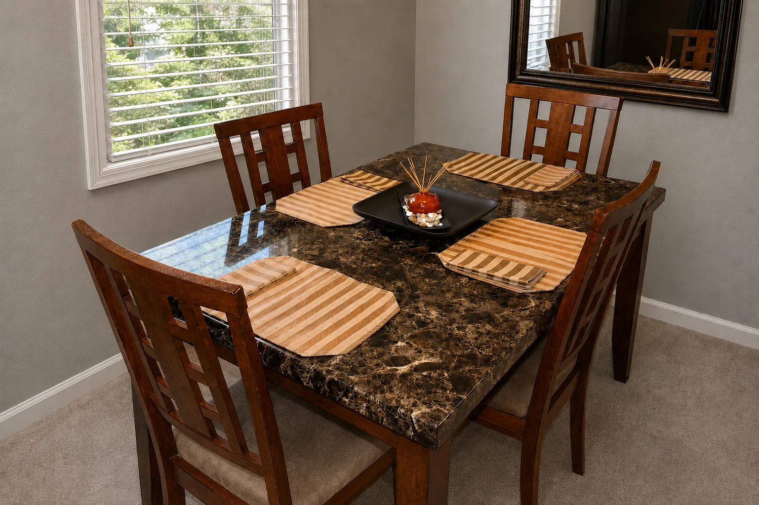 Dining table in apartment 1303 D with Morningside trees outside