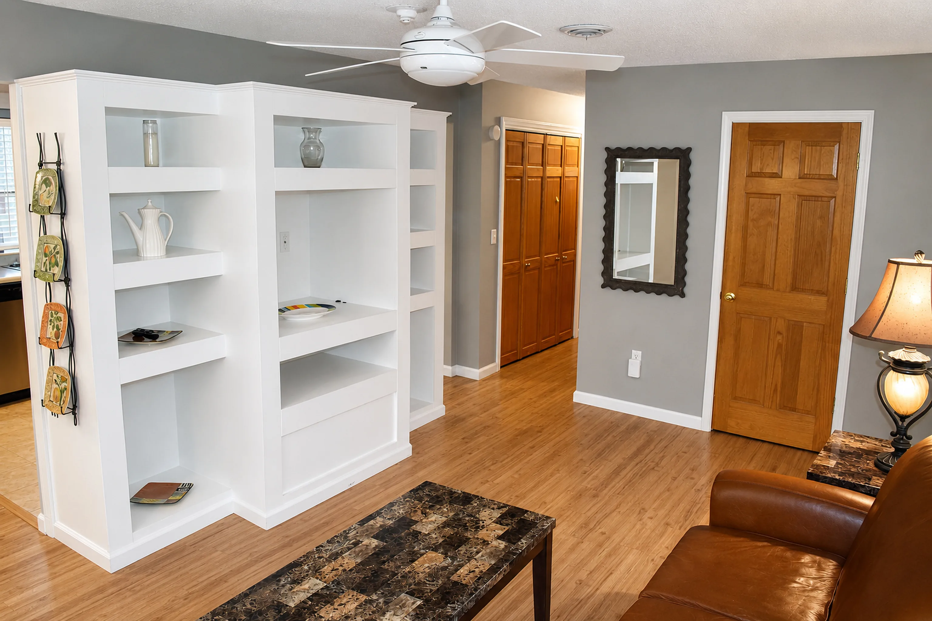 Living room and built-in shelving in apartment 1305 D