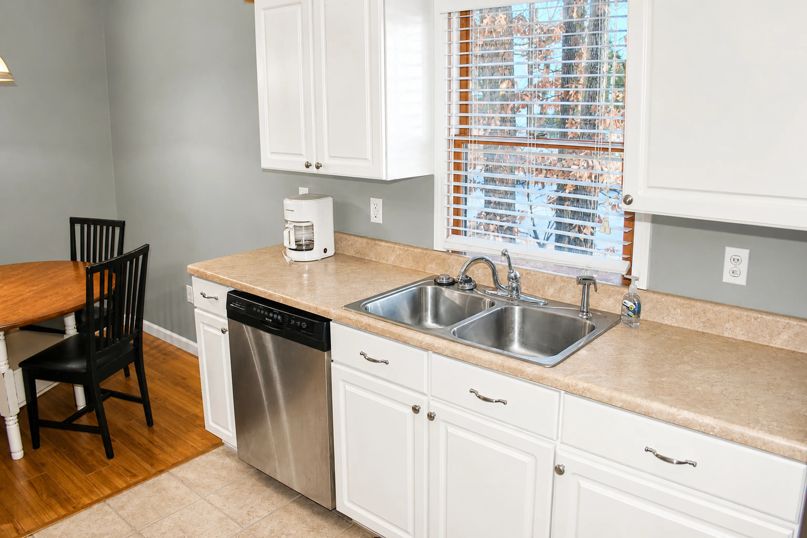 Kitchen sink and cabinetry in apartment 1305 D