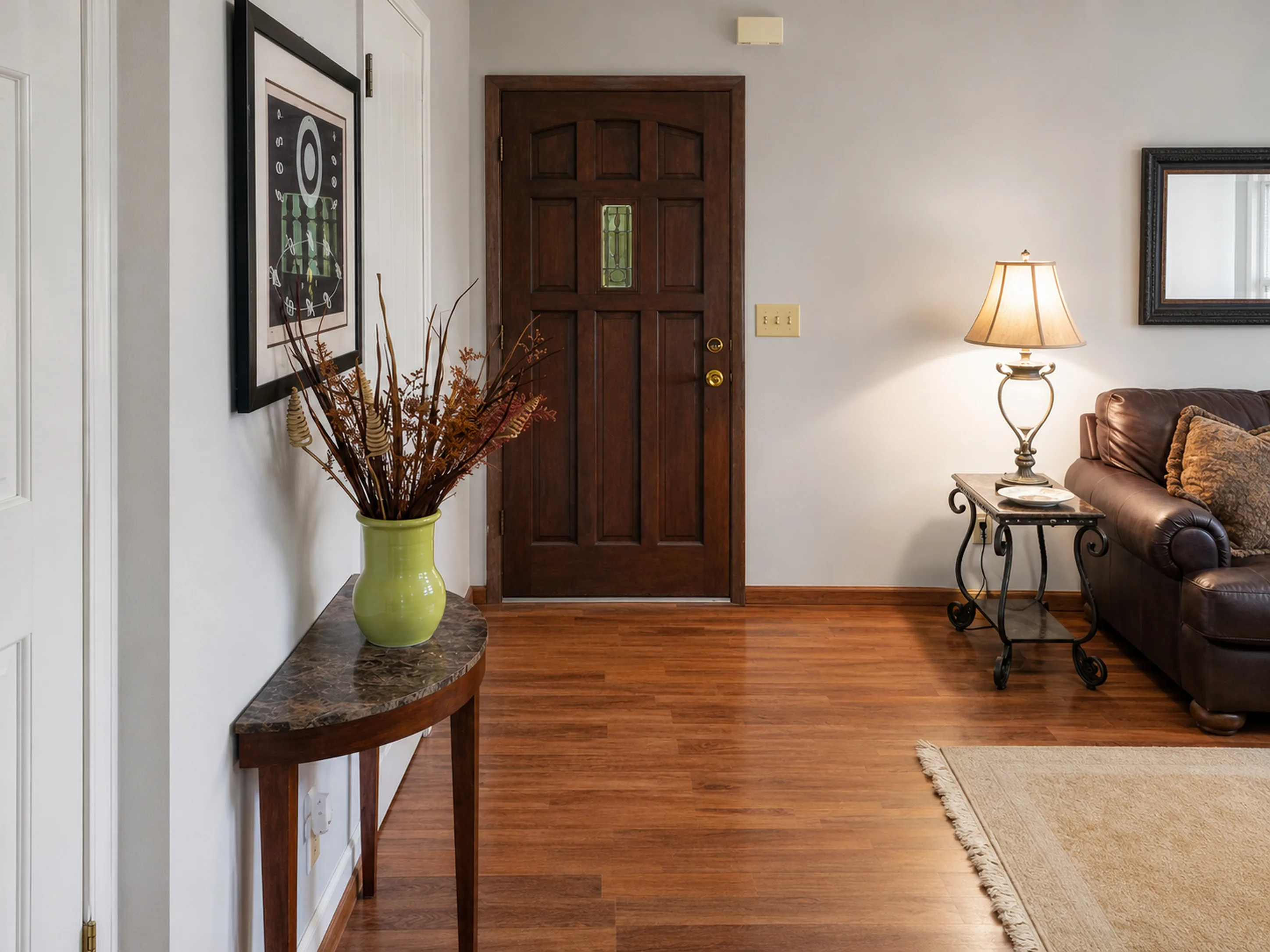 Apartment entry opening into the living room in apartment 1307 B