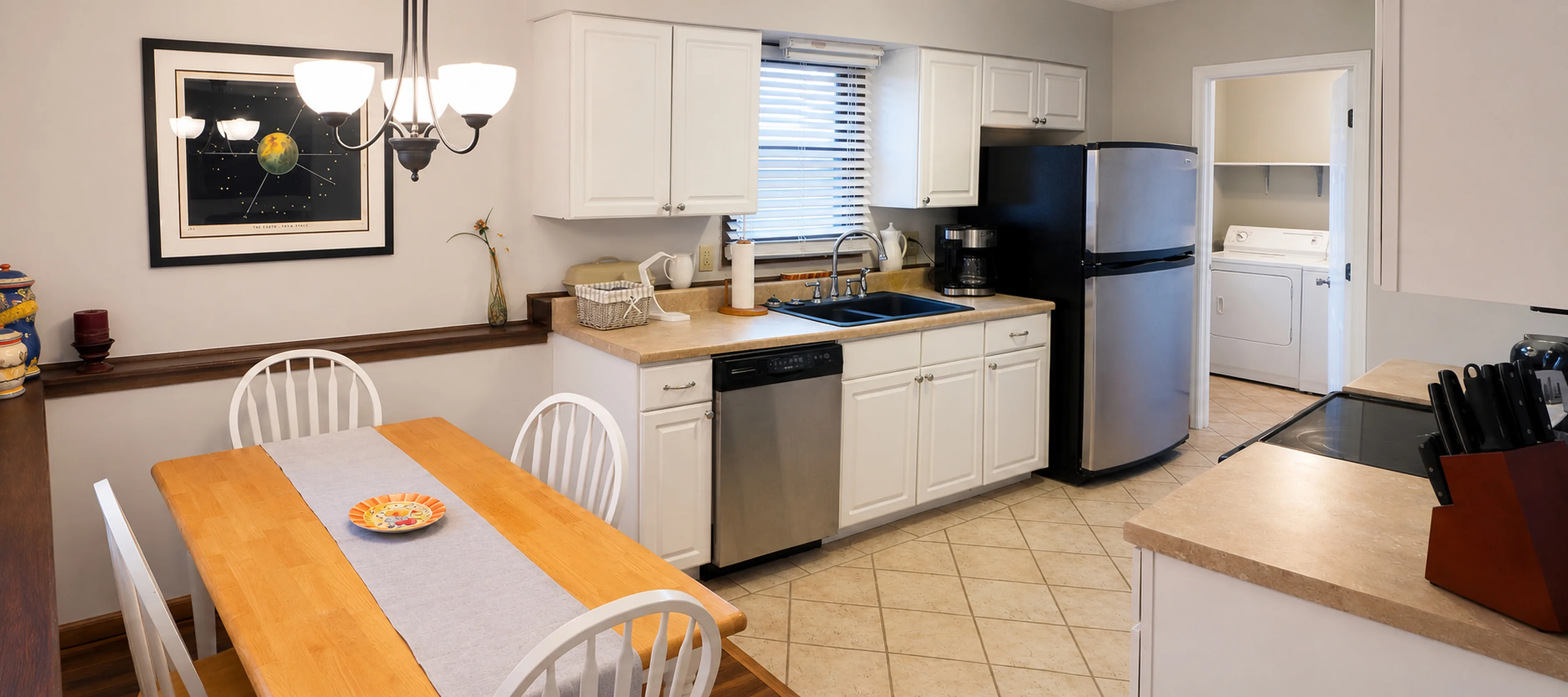 Panoramic view of the kitchen and dining area in apartment 1307 B